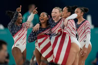 | Photo: AP/Abbie Parr : Team USA celebrate after winning the gold medal